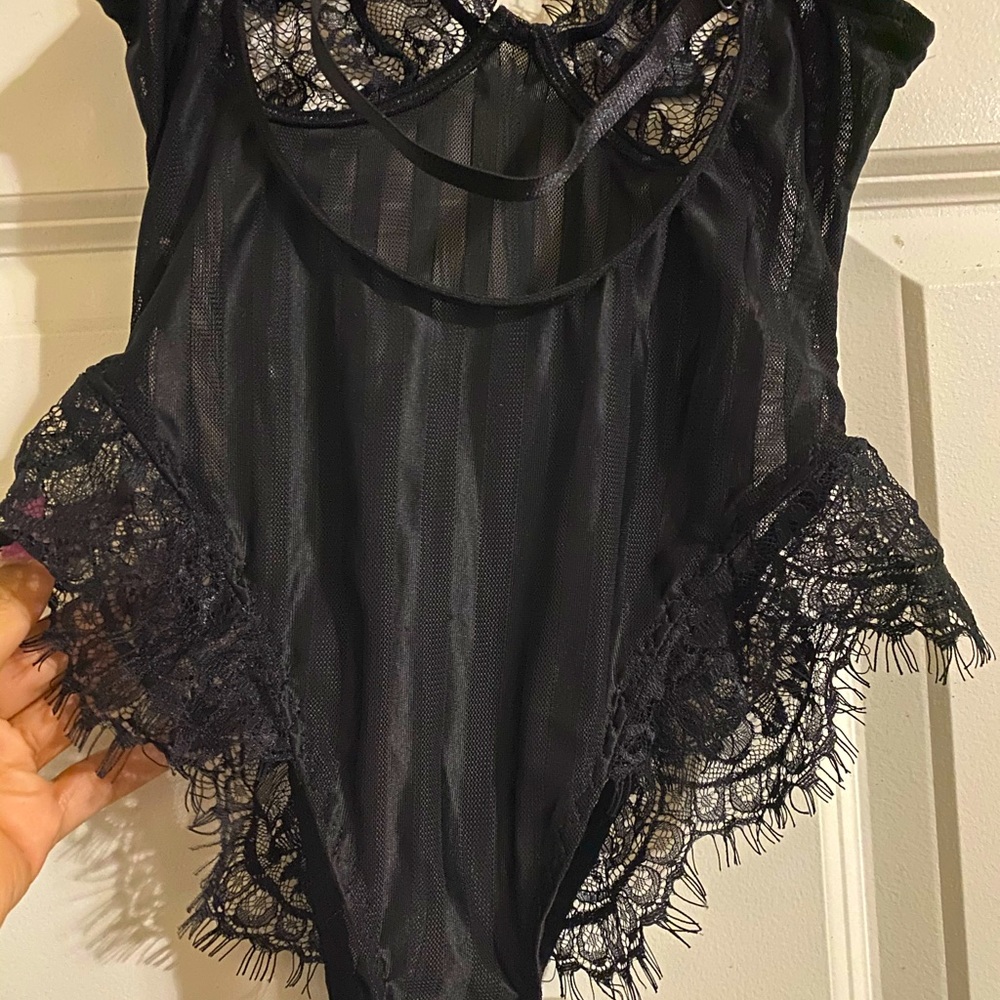 A black, new teddy or bodysuit.